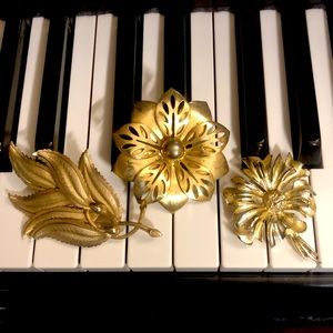 Three vintage large gold tone brooches